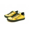 Women's Shoes Shimmering gold sneakers slip on model with round toe and black rubber sole.