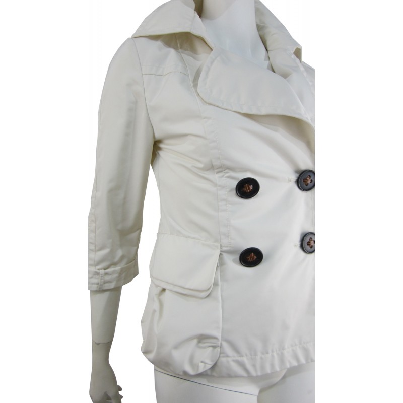 Double breasted woman jacket 2 overlapping pockets with wide buttons and 3/4 sleeves.
