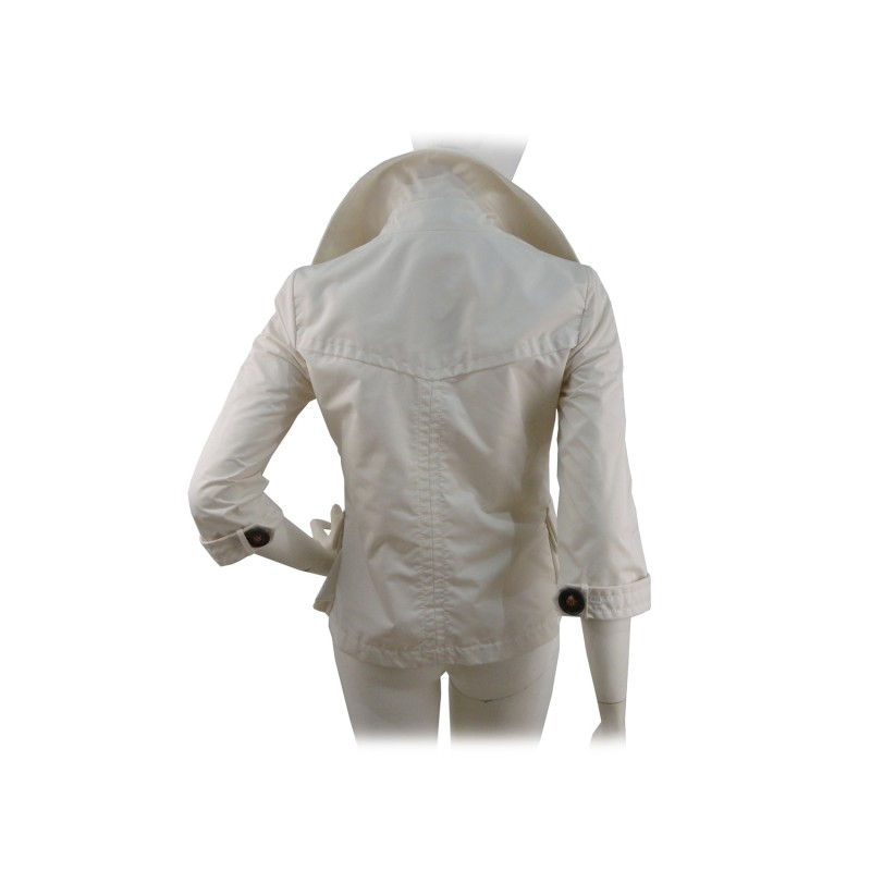 Double breasted woman jacket 2 overlapping pockets with wide buttons and 3/4 sleeves.
