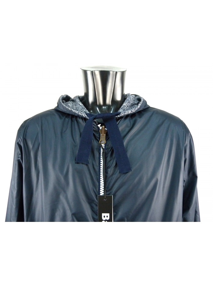 Reversible men's jacket with hood and elastic cuffs.