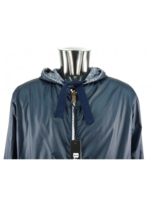 Reversible men's jacket with hood and elastic cuffs.