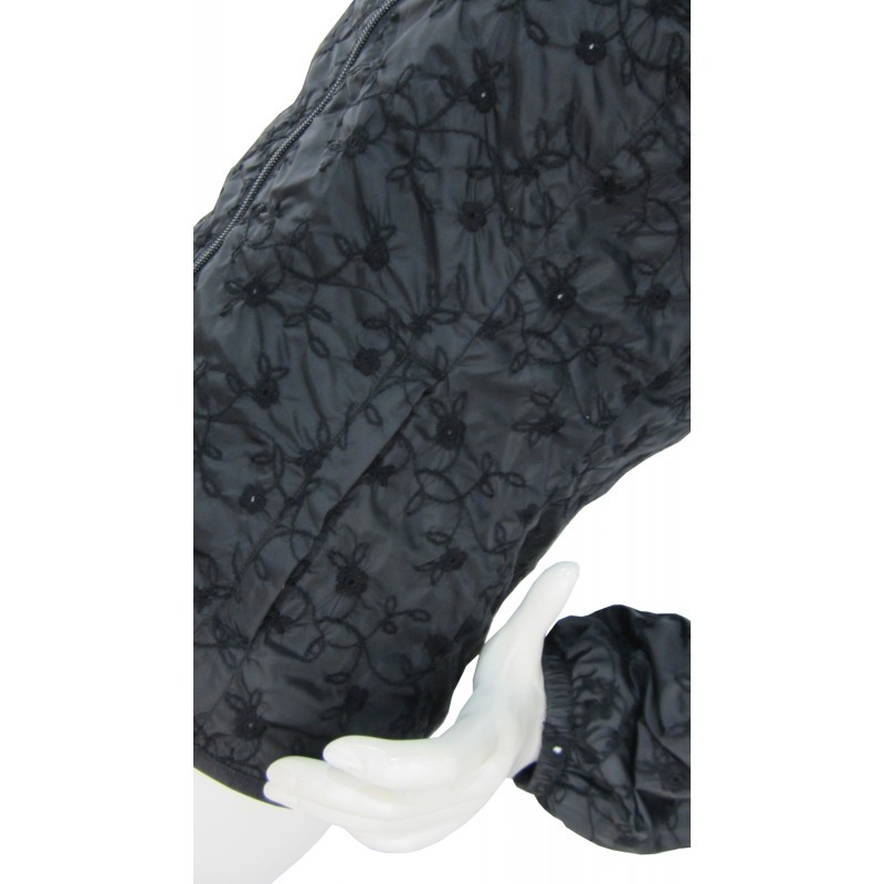 Woman jacket with zip pockets and belt with buckle.