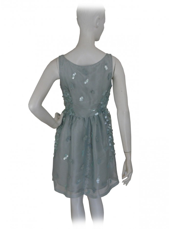 Elegant woman dress, round neckline with sequin inserts on the same color