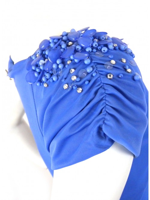 Woman dress with soft neckline, rhinestone inserts and beads 