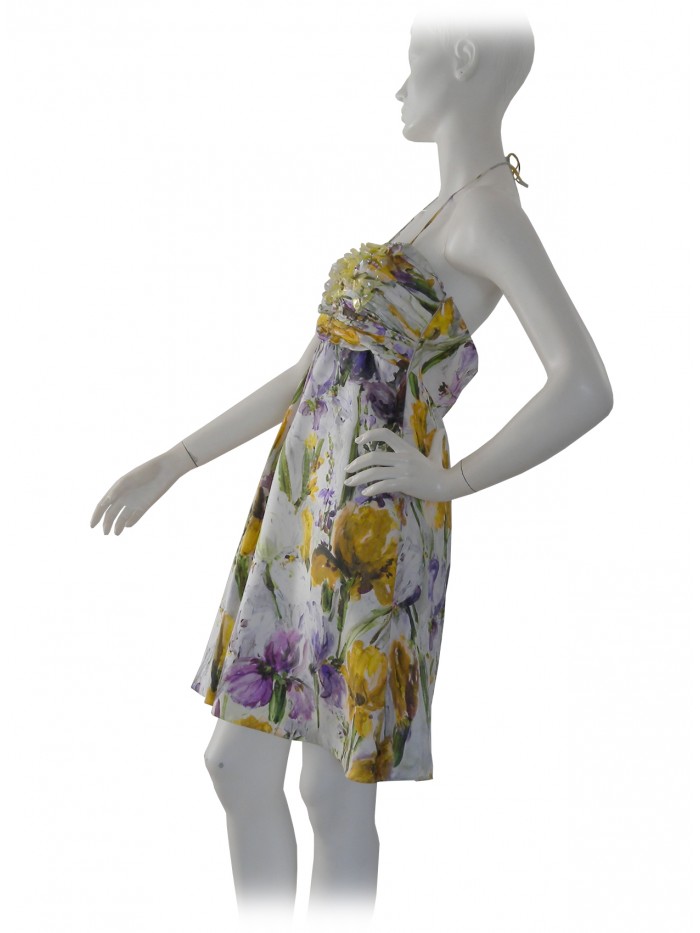 Woman dress with floral patterned pleats inserts stones and straps