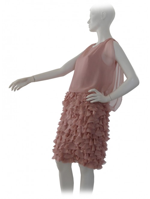 Elegant woman dress with sheer bodice and flounced skirt.