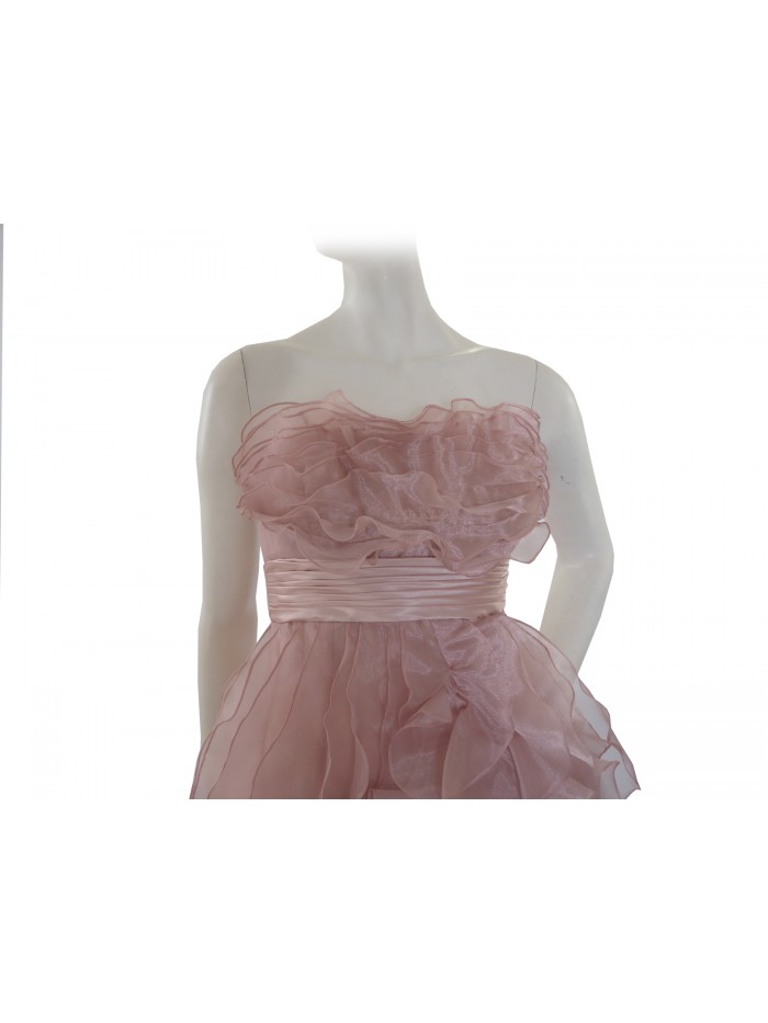 Elegant woman dress without straps, decorated with flounces