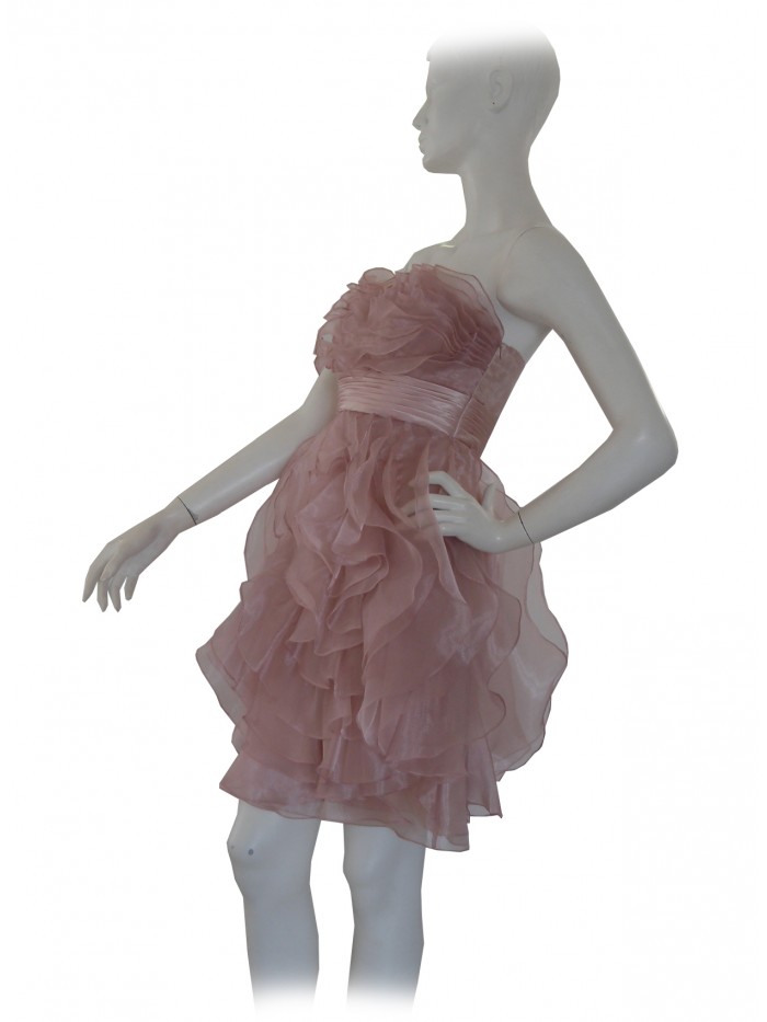 Elegant woman dress without straps, decorated with flounces