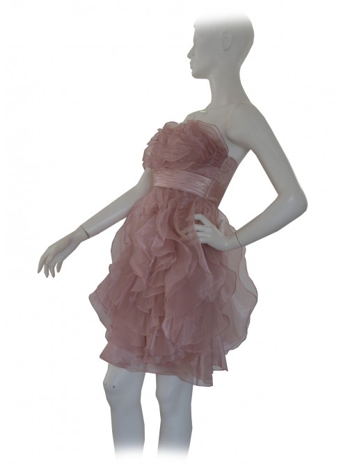 Elegant woman dress without straps, decorated with flounces