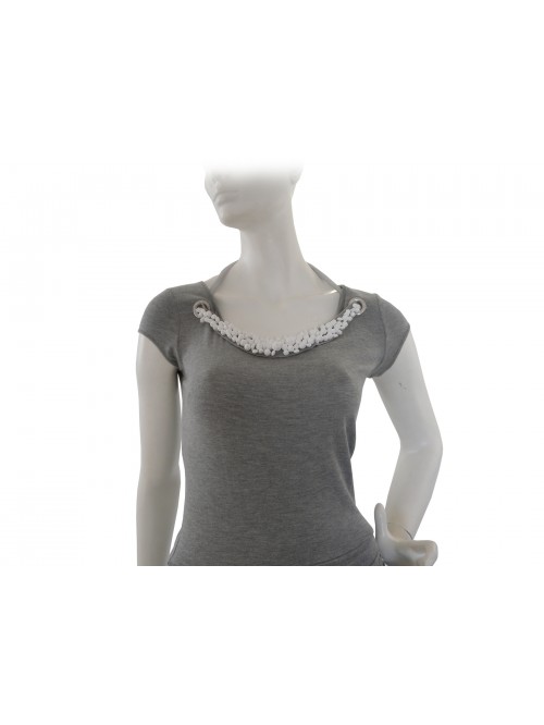Slim woman dress with necklace-like decoration with white stone inserts