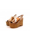 Woman sandals with wedge lined with cork, glossy bronzed effect.