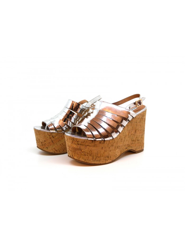 Woman sandals with wedge lined with cork, glossy silver effect. Woman sandals with wedge lined with cork, glossy silver effect.