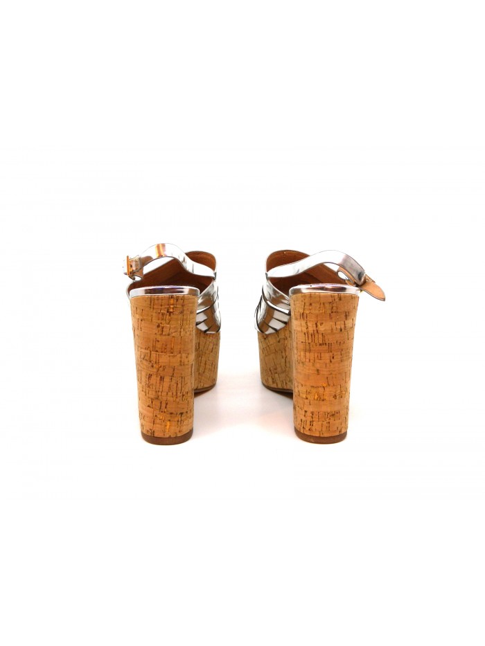 Woman sandals with wedge lined with cork, glossy silver effect.