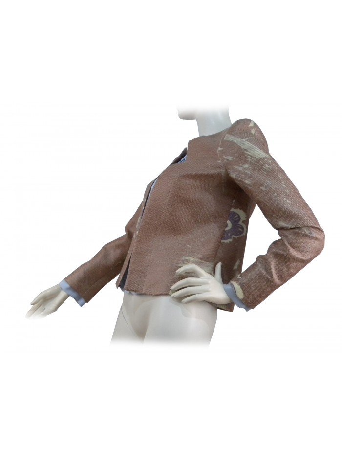 Woman open jacket with lilac floral pattern on camel background