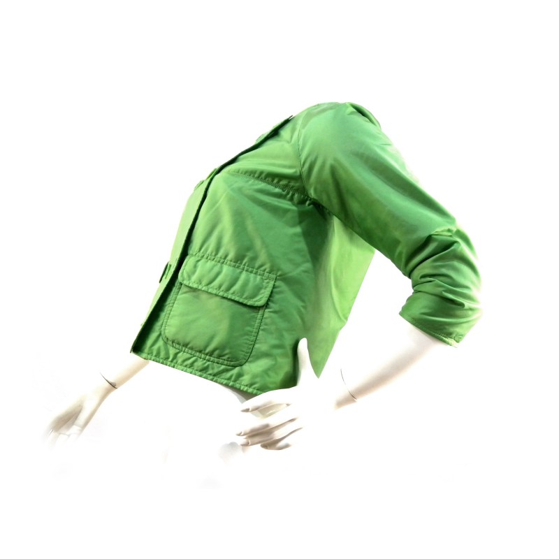 Short double-breasted Aba woman jacket round neck with visible pockets.