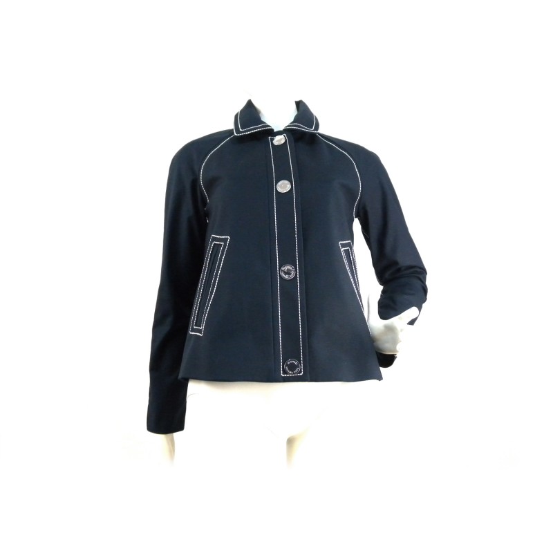 Short jacket woman shirt collar 2 pockets with stitching at sight with silver contrast buttons and white visible stitching. Short jacket woman shirt collar 2 pockets with stitching at sight with silver contrast buttons and white visible stitching.